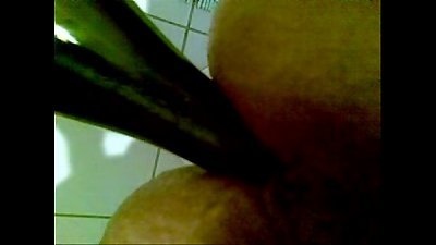 lady pummels herself with a bottle and films it